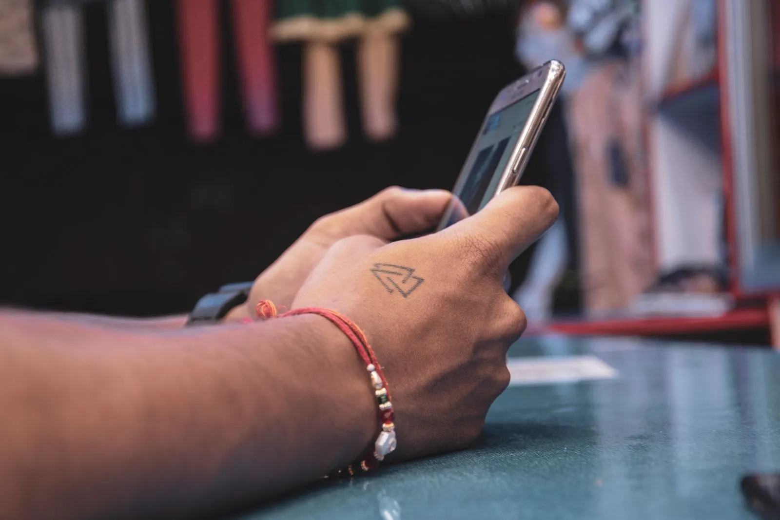 Person checking a smartphone, illustrating the everyday mobile service a Lifeline benefit covers
